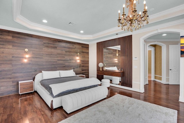 718 Edgebrook Ln, West Palm Beach, FL 33411 - bedroom featuring arched walkways, a chandelier, wood finished floors, ornamental molding, and a raised ceiling