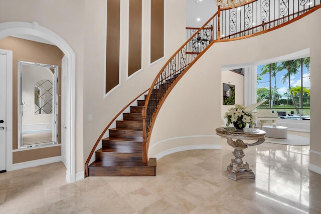718 Edgebrook Ln, West Palm Beach, FL 33411 - stairway with a towering ceiling and arched walkways