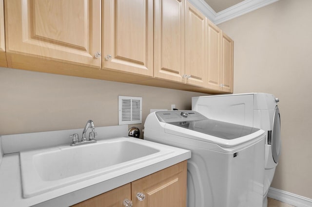 718 Edgebrook Ln, West Palm Beach, FL 33411 - laundry area with cabinet space, separate washer and dryer, and crown molding