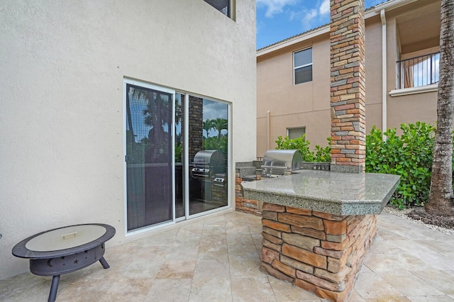 718 Edgebrook Ln, West Palm Beach, FL 33411 - view of patio / terrace with an outdoor kitchen
