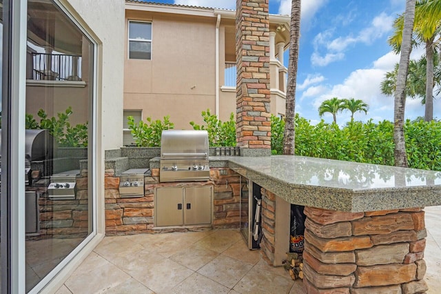 718 Edgebrook Ln, West Palm Beach, FL 33411 - view of patio / terrace with exterior kitchen