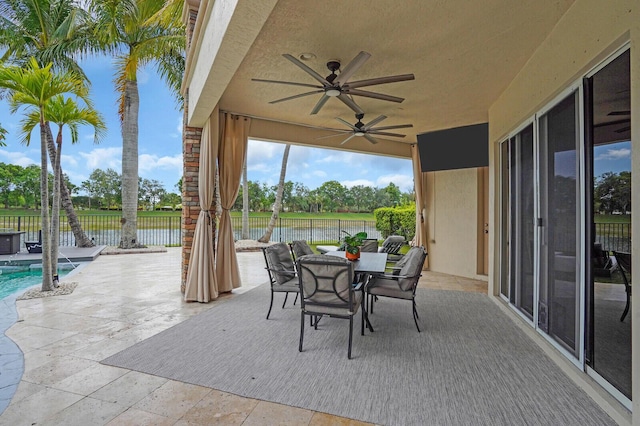 718 Edgebrook Ln, West Palm Beach, FL 33411 - fenced backyard with a patio area, ceiling fan, and outdoor dining space