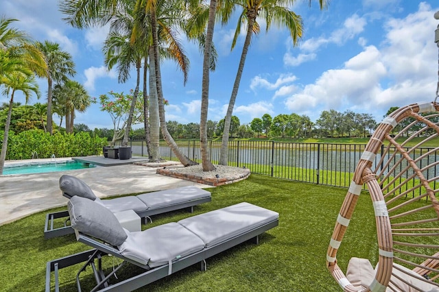 718 Edgebrook Ln, West Palm Beach, FL 33411 - fenced backyard featuring a water view and a patio