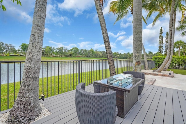 718 Edgebrook Ln, West Palm Beach, FL 33411 - wooden terrace with a water view and outdoor dining space