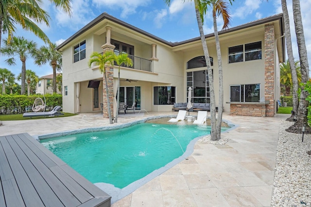 718 Edgebrook Ln, West Palm Beach, FL 33411 - outdoor pool with a ceiling fan and a patio