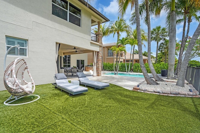 718 Edgebrook Ln, West Palm Beach, FL 33411 - rear view of house featuring stucco siding, ceiling fan, an outdoor pool, a balcony, and stairway