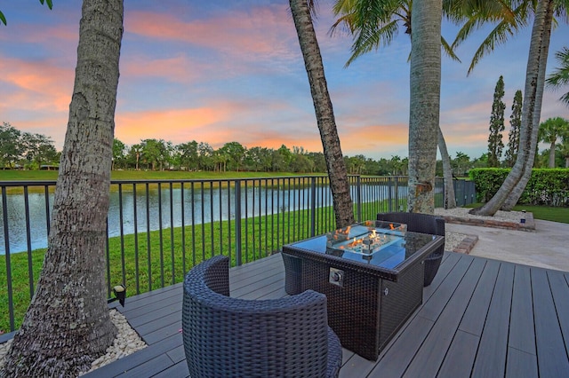 718 Edgebrook Ln, West Palm Beach, FL 33411 - deck with a fire pit, a water view, and a lawn