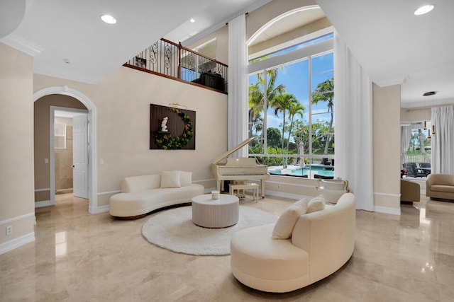 718 Edgebrook Ln, West Palm Beach, FL 33411 - living area with marble tiled flooring, arched walkways, and recessed lighting