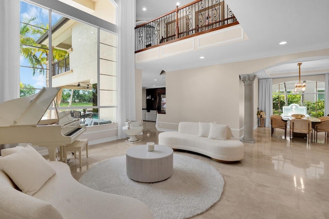718 Edgebrook Ln, West Palm Beach, FL 33411 - living area with decorative columns, healthy amount of natural light, a high ceiling, and recessed lighting