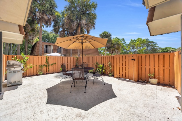 182 Charter Way, West Palm Beach, FL 33407 - fenced backyard featuring area for grilling, a patio, and outdoor dining area