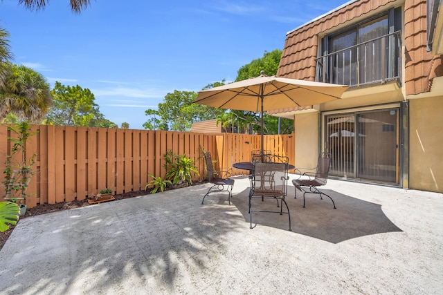 182 Charter Way, West Palm Beach, FL 33407 - fenced backyard featuring a patio and outdoor dining area