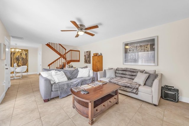 182 Charter Way, West Palm Beach, FL 33407 - living room with stairway, a chandelier, ceiling fan, and light tile patterned floors