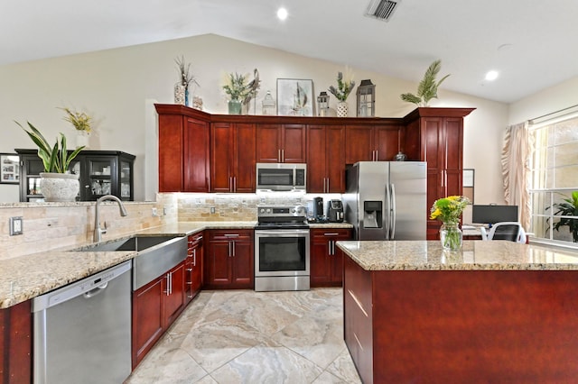 8404 Long Bay, West Palm Beach, FL 33411 - kitchen with dark brown cabinets, appliances with stainless steel finishes, lofted ceiling, light marble finish flooring, and recessed lighting