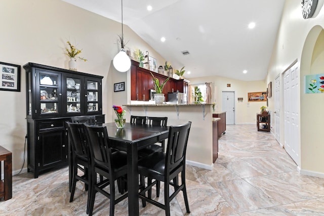 8404 Long Bay, West Palm Beach, FL 33411 - dining room with vaulted ceiling, light marble finish flooring, and recessed lighting