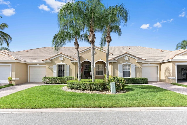 8404 Long Bay, West Palm Beach, FL 33411 - view of front of home with stucco siding, an attached garage, and a front lawn