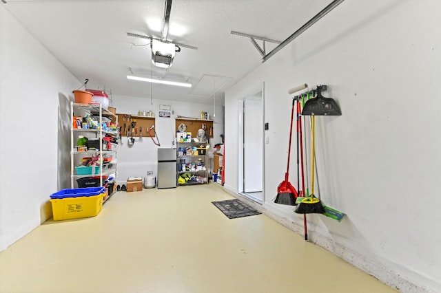 8404 Long Bay, West Palm Beach, FL 33411 - garage featuring freestanding refrigerator and a garage door opener