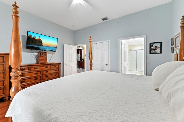 8404 Long Bay, West Palm Beach, FL 33411 - bedroom with wood finished floors, ceiling fan, and ensuite bathroom