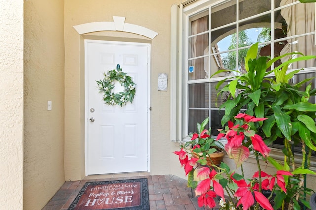 8404 Long Bay, West Palm Beach, FL 33411 - view of exterior entry featuring stucco siding