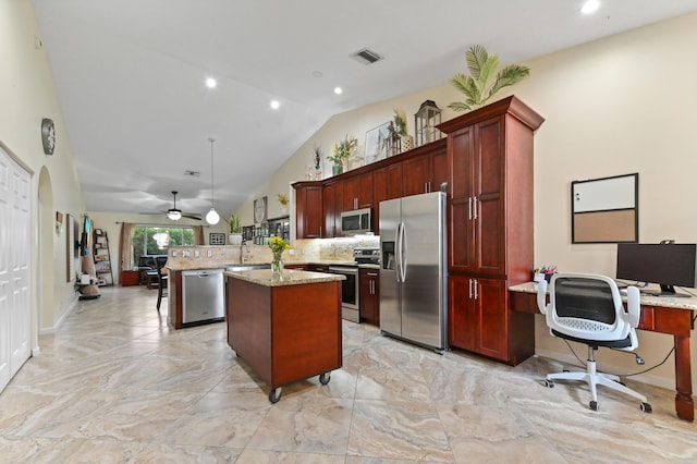 8404 Long Bay, West Palm Beach, FL 33411 - kitchen with appliances with stainless steel finishes, dark brown cabinets, a peninsula, a center island, and a desk