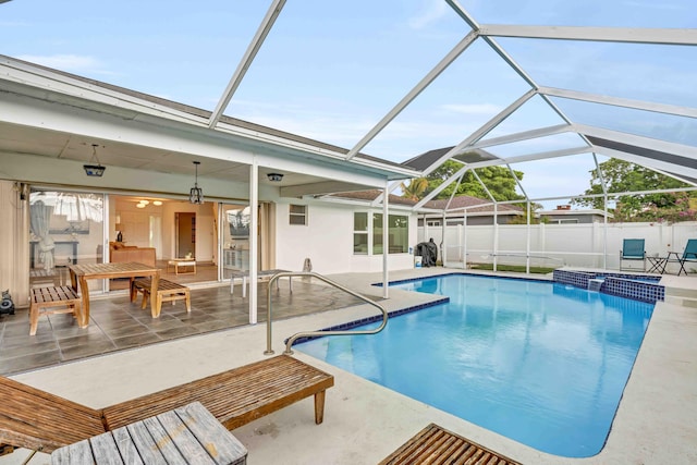 108 Timber Run E, Riviera Beach, FL 33407 - view of swimming pool with a patio area, a pool with connected hot tub, and glass enclosure