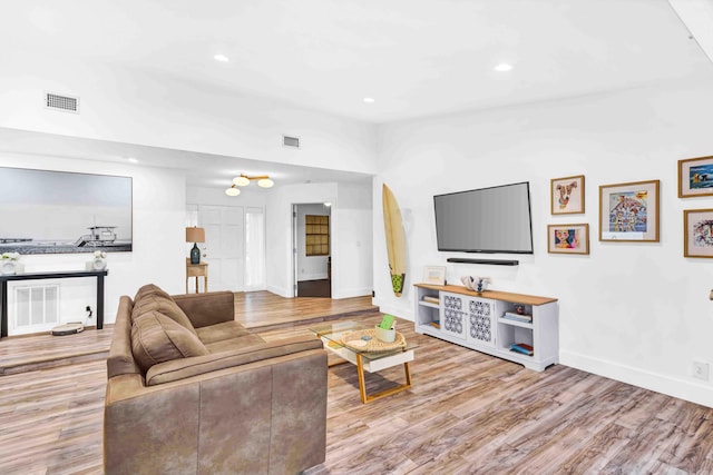 108 Timber Run E, Riviera Beach, FL 33407 - living area featuring wood finished floors, recessed lighting, and lofted ceiling