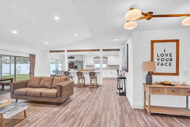 108 Timber Run E, Riviera Beach, FL 33407 - living area with light wood-style flooring, healthy amount of natural light, recessed lighting, and lofted ceiling