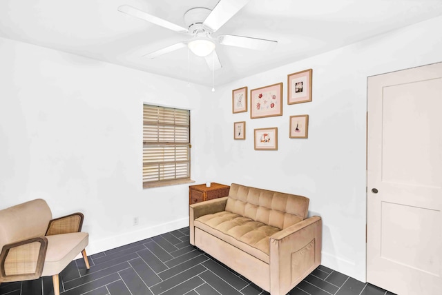 108 Timber Run E, Riviera Beach, FL 33407 - sitting room with ceiling fan and dark tile patterned floors