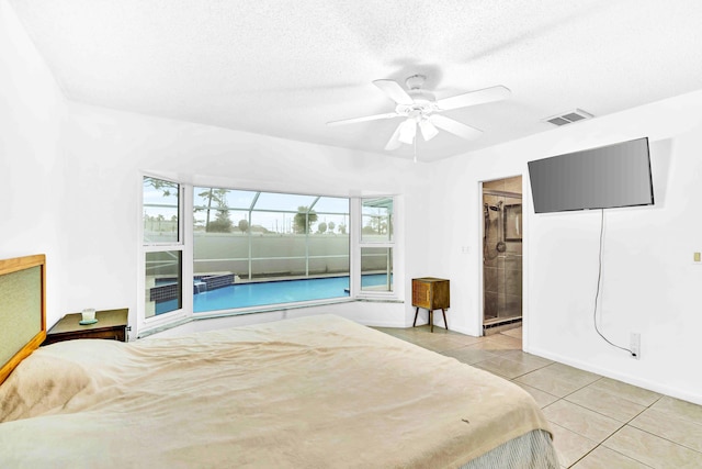 108 Timber Run E, Riviera Beach, FL 33407 - bedroom with light tile patterned floors, a ceiling fan, and a textured ceiling