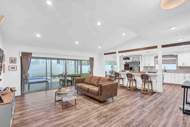 108 Timber Run E, Riviera Beach, FL 33407 - living area featuring light wood finished floors, recessed lighting, and vaulted ceiling