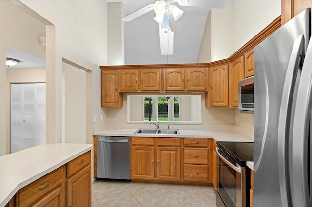 416 Cottonwood Pl, Boca Raton, FL 33431 - kitchen with appliances with stainless steel finishes, light tile patterned floors, a ceiling fan, light countertops, and high vaulted ceiling