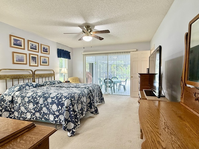 13021 150th Ct N, Jupiter, FL 33478 - carpeted bedroom with access to outside, a textured ceiling, and ceiling fan