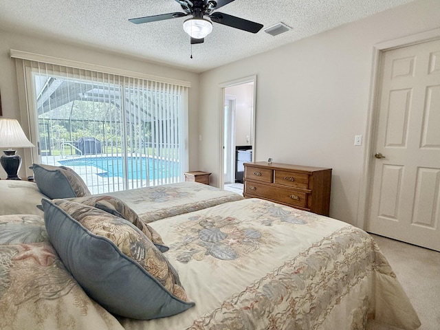 13021 150th Ct N, Jupiter, FL 33478 - bedroom with access to outside, light colored carpet, a textured ceiling, and a ceiling fan