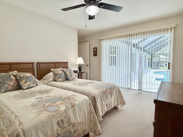 13021 150th Ct N, Jupiter, FL 33478 - carpeted bedroom featuring access to exterior, a textured ceiling, and a ceiling fan