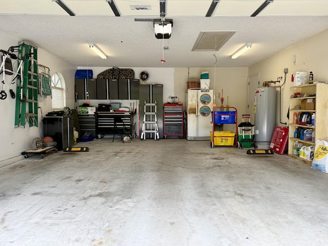 13021 150th Ct N, Jupiter, FL 33478 - garage with water heater and a garage door opener