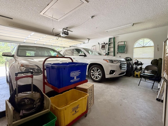 13021 150th Ct N, Jupiter, FL 33478 - garage featuring a garage door opener