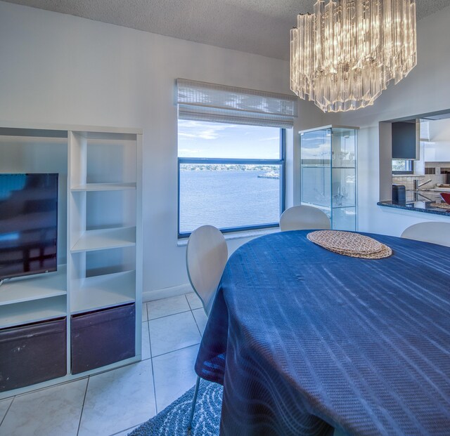 896 N Federal Hwy Unit 324, Lantana, FL 33462 - dining area featuring tile patterned floors and a chandelier