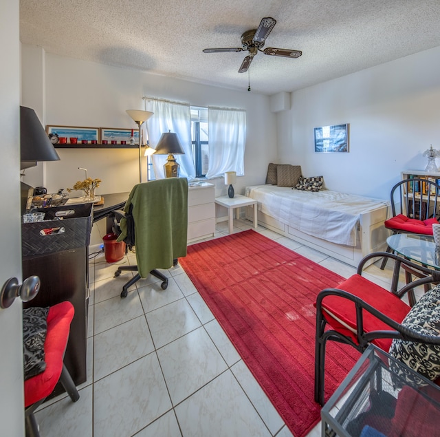 896 N Federal Hwy Unit 324, Lantana, FL 33462 - bedroom with a textured ceiling, tile patterned floors, and a ceiling fan