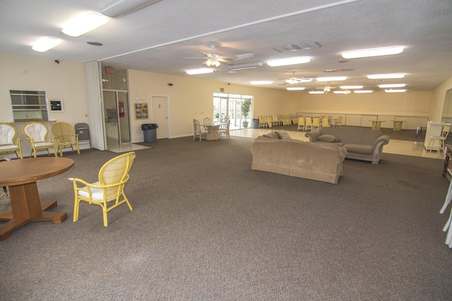 896 N Federal Hwy Unit 324, Lantana, FL 33462 - carpeted living area with a ceiling fan and a textured ceiling