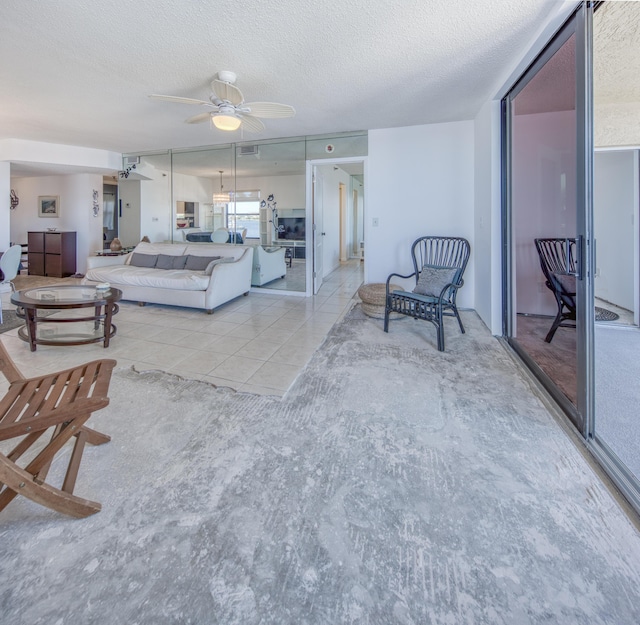 896 N Federal Hwy Unit 324, Lantana, FL 33462 - living room with a ceiling fan, a textured ceiling, and light tile patterned flooring
