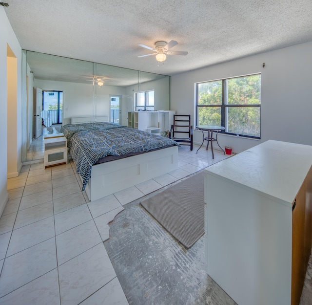 896 N Federal Hwy Unit 324, Lantana, FL 33462 - bedroom featuring a textured ceiling and light tile patterned flooring