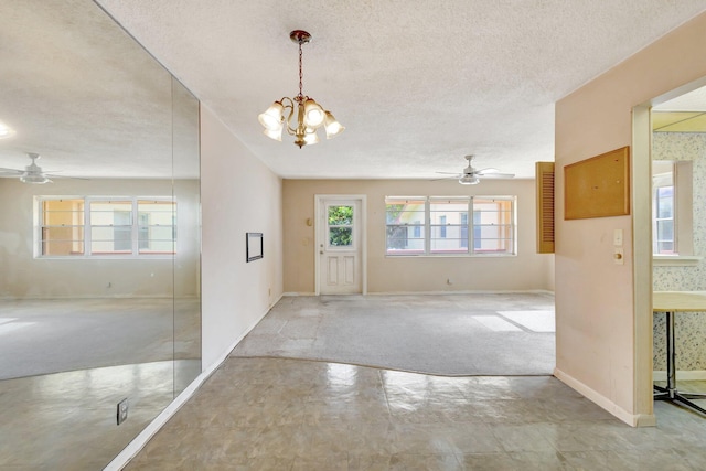 47 Camden Unit B, West Palm Beach, FL 33417 - foyer entrance with ceiling fan, a textured ceiling, and a chandelier