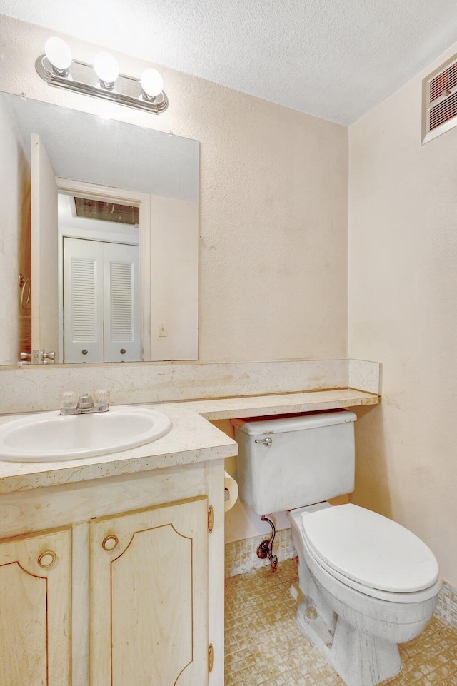 47 Camden Unit B, West Palm Beach, FL 33417 - bathroom featuring vanity and a textured ceiling