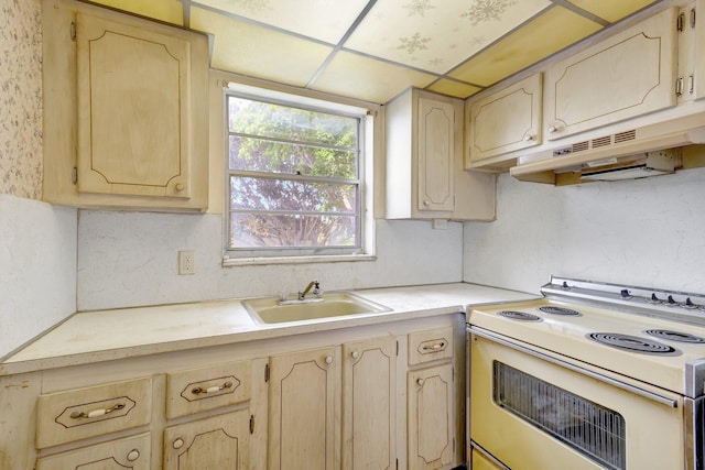 47 Camden Unit B, West Palm Beach, FL 33417 - kitchen featuring electric range, light countertops, under cabinet range hood, and light brown cabinetry