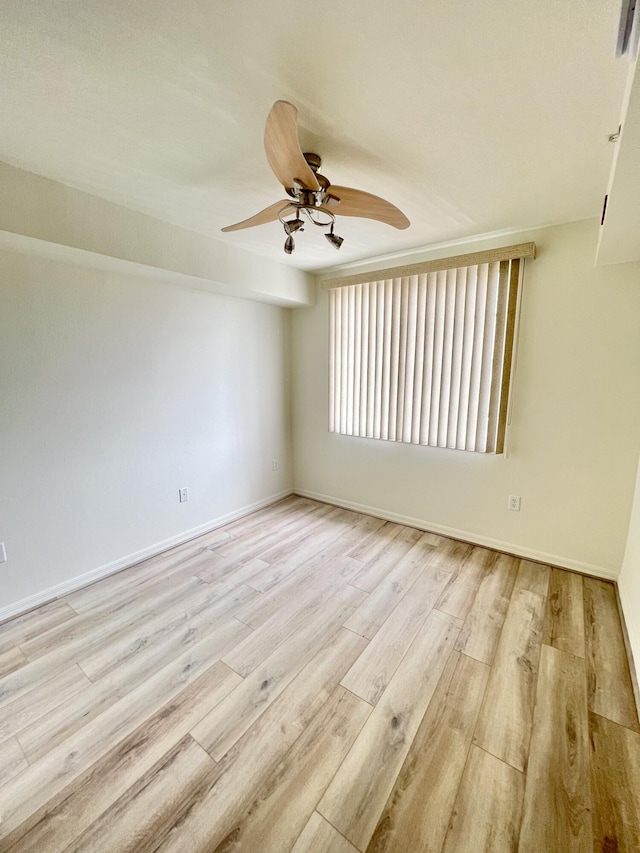 6761 Heritage Grande Unit 3303, Boynton Beach, FL 33437 - spare room with a ceiling fan and wood finished floors