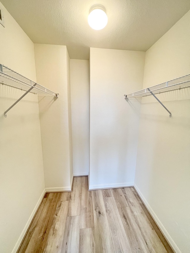 6761 Heritage Grande Unit 3303, Boynton Beach, FL 33437 - spacious closet featuring wood finished floors