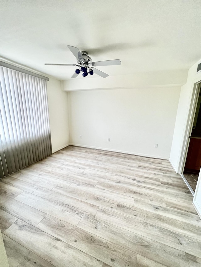 6761 Heritage Grande Unit 3303, Boynton Beach, FL 33437 - empty room featuring light wood-style flooring and a ceiling fan