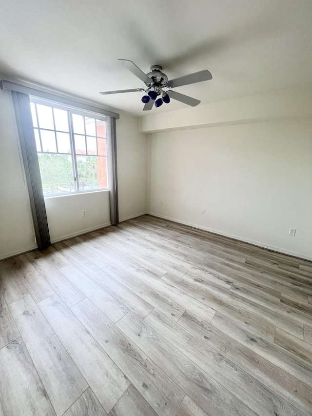 6761 Heritage Grande Unit 3303, Boynton Beach, FL 33437 - empty room featuring wood finished floors and ceiling fan