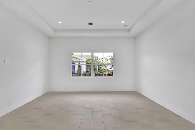 10051 Timber Creek Way, Palm Beach Gardens, FL 33412 - empty room featuring a tray ceiling and recessed lighting