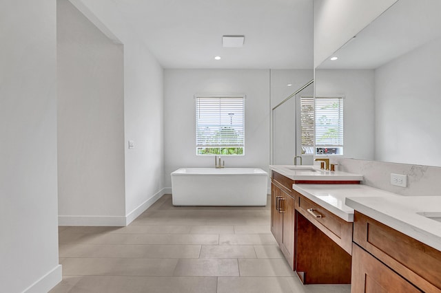 10051 Timber Creek Way, Palm Beach Gardens, FL 33412 - bathroom with healthy amount of natural light, a freestanding bath, double vanity, a shower stall, and recessed lighting
