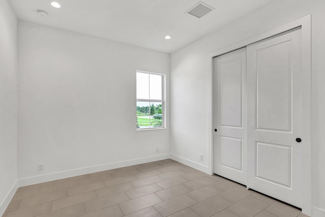 10051 Timber Creek Way, Palm Beach Gardens, FL 33412 - unfurnished bedroom with recessed lighting and a closet